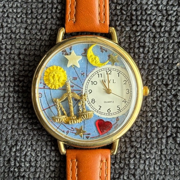 WYL Zodiac Design Quartz Watch in gold tone with brown leather strap. - Picture 1 of 8